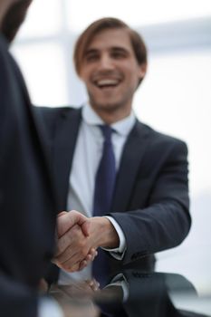 vertical photo.handshake business people .close up.