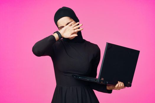 cheerful muslim woman with laptop education student internet technology. High quality photo