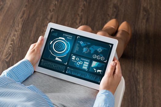 close-up business woman with computer tablet on lap