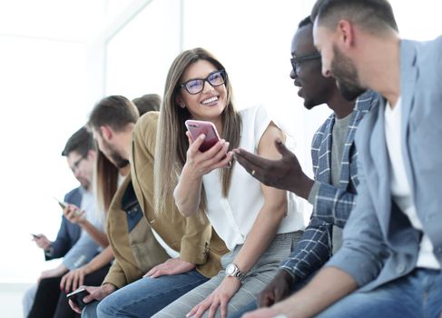 group of young people with smartphones.people and technology