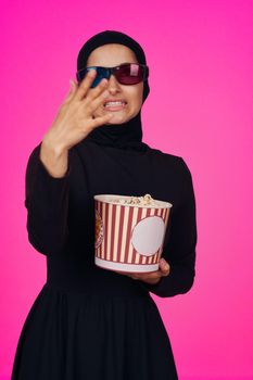 arab woman entertainment cinema popcorn fashion isolated background. High quality photo