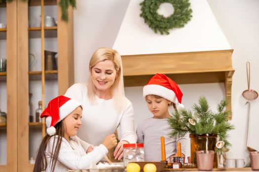 kids baking christmas cookies before the celebration of Christmas. Family