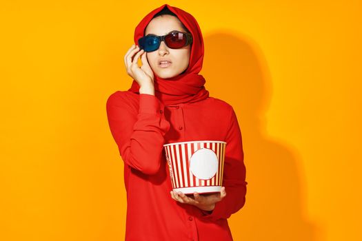 Muslim virtual reality movie fashion fun movie yellow background. High quality photo