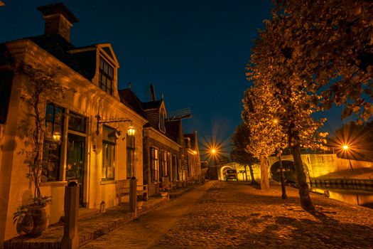 Historical houses in the city Sloten in the Netherlands at night