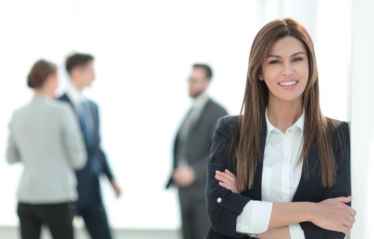 young business woman on blurred office background. photo with copy space