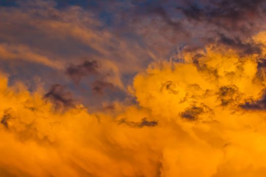 Background from a bright colorful sunset with clouds. High quality photo