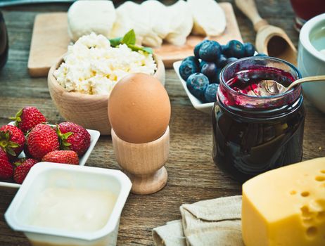 Summer breakfast. fruit and dairy products on a wooden table
