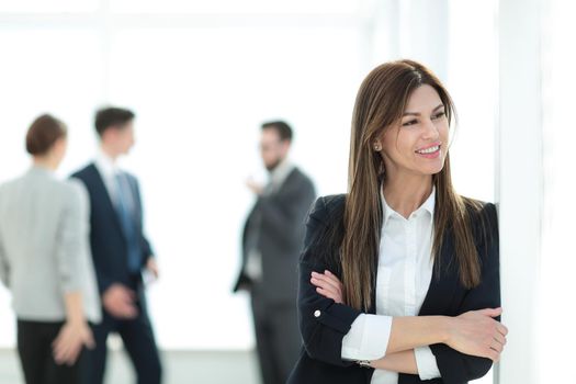 young business woman on blurred office background. photo with copy space