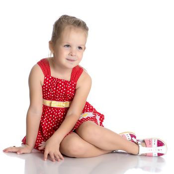 Fashionable little girl in a dress. Beauty and style in children's clothes. Isolated over white background