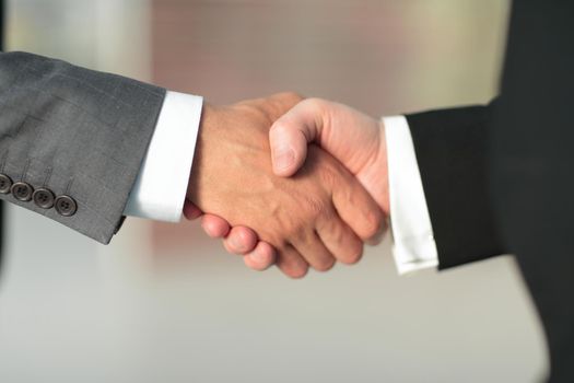 close up.reliable handshake of business partners.the concept of cooperation