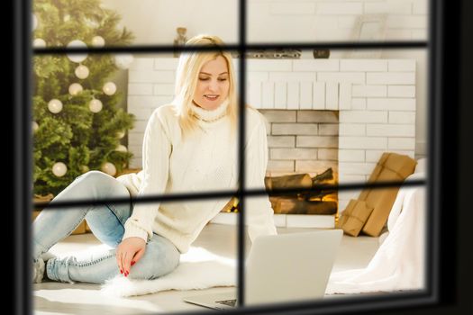 wiew through the window, Christmas Tree on background, winter holiday concept