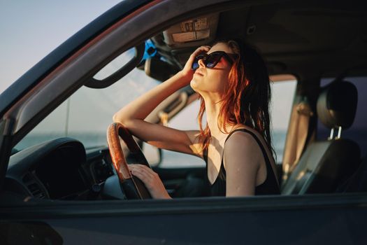 woman driving in car trip posing fashion travel. High quality photo