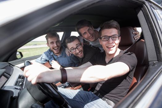 Group Of Friends In Car On Road Trip . joint trip