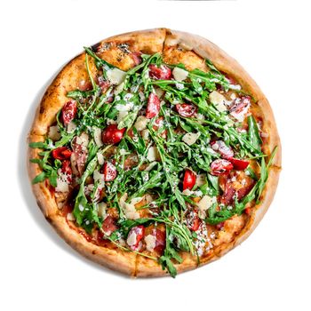 Pizza with dry cured ham and arugula on the white background