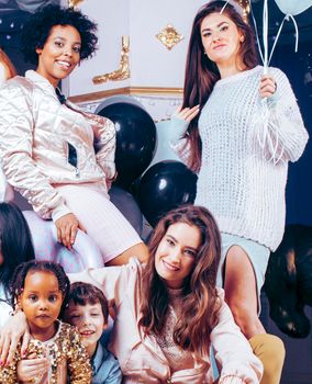 Lifestyle and people concept: young pretty diversity nations woman with different age children celebrating on birth day party together happy smiling, making selfie. African-american, asian and caucasian close up