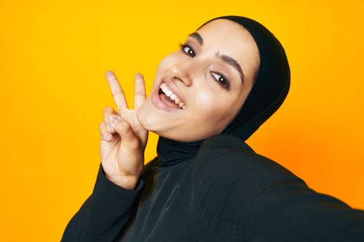 cheerful woman fun ethnicity model posing emotions yellow background. High quality photo