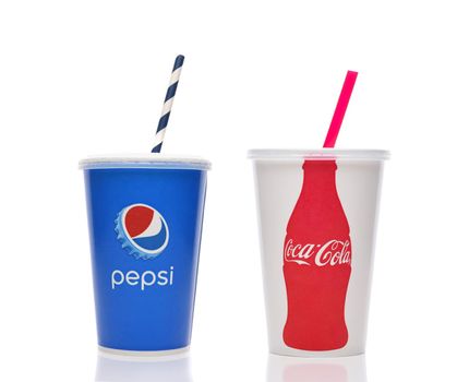 IRVINE, CALIFORNIA - 11 jun 2021: A Pepsi  and Coca-Cola paper disposable cup with straws.