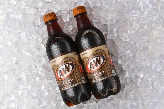 IRVINE, CALIFORNIA - 26 JUNE 2021: Two A and W Root Beer bottles on ice. Owned by Dr Pepper Snapple Group and distributed by the Coca-Cola Company in the USA.