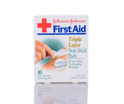IRVINE, CA - January 05, 2014: A box of Johnson & Johnson First Aid Non-Stick Pads. A 10 count package of Triple Layer Sterile pads for wounds.