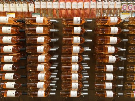 TUSTIN, CA - SEPTEMBER 23, 2017: Display of Rose Wine bottles at Whole Food Market. Rose wine is enjoying a revival with drinkers in the United States.