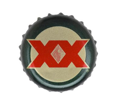 IRVINE, CALIFORNIA - 4 JUNE 2020: Closeup of a Dos Equis beer bottle cap on white.