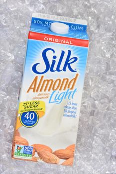 IRVINE, CA - JULY 23, 2015: A carton of Silk Almond Light on a bed of ice. Silk produces a line of almondmilk drinks that are dairy free.