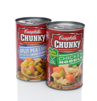 IRVINE, CA - DECEMBER 12, 2014: Two cans of Campbell's Chunky Soup, Split Pea and Chicken Noodle. Headquartered in Camden, New Jersey, Campbell's products are sold in 120 countries around the world. 