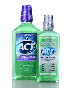 IRVINE, CA - January 05, 2014: Two bottles of ACT Total Care Anticavity Rinse. A 1 liter bottle and an 18 oz bottle of the oral hygiene mouthwash with fluoride.