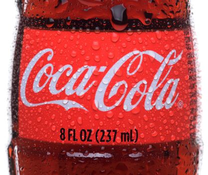 IRVINE, CA - February 14, 2013: Photo of an 8 ounce bottle of Coca-Cola Classic with condensatio. Coca-Cola is the one of the worlds favorite carbonated beverages.