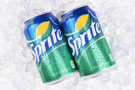 IRVINE, CALIFORNIA - JULY 10, 2017: Two Sprite Cans on a bed of ice with condensation. Sprite is a lemon lime soft drink from the Coca-Cola Comapny.