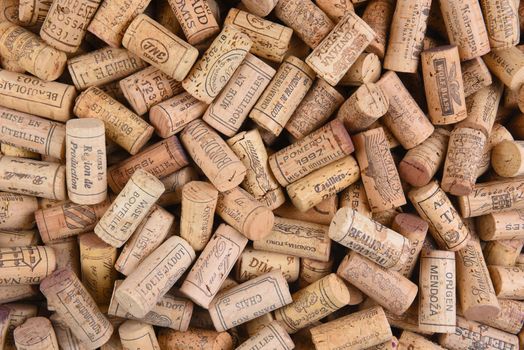 IRVINE, CALIFORNIA - FEBRUARY 14, 2018: A pile of imported wine corks from a variety of wineries and countries. 