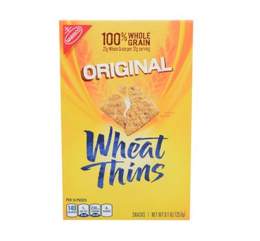IRVINE, CA - FEBRUARY 19, 2015: Nabisco Wheat Thins Crackers. Originally known as the National Biscuit Company, Nabisco is an American manufacturer of cookies and snacks. 