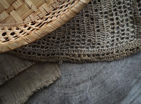 Background from cross section of tree trunk, natural linen napkins and a straw basket