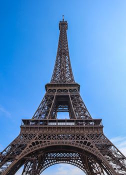 Eiffel Tower in Paris France against blue sky. April 2019