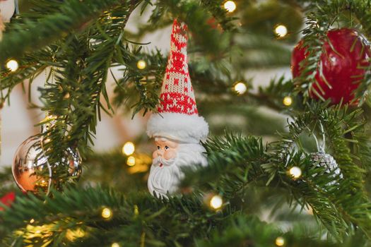 Ceramic Christmas toy Santa Claus hanging on the Christmas tree