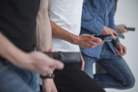 close up.a group of young people with smartphones.people and technology