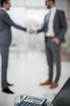 blurred image of a handshake of business people in the office.business background