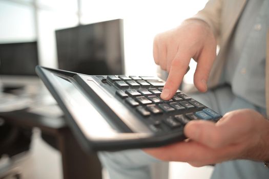 close up. businessman using calculator .business concept