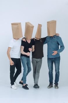 in full growth. a group of men with paper bags on their heads.photo with copy space