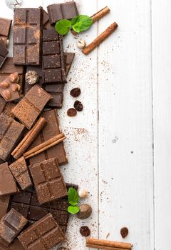variety of chocolate on a wooden background with space for text