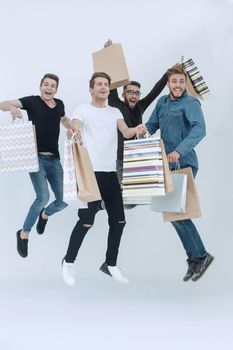group of dancing friends with shopping. the concept of happiness