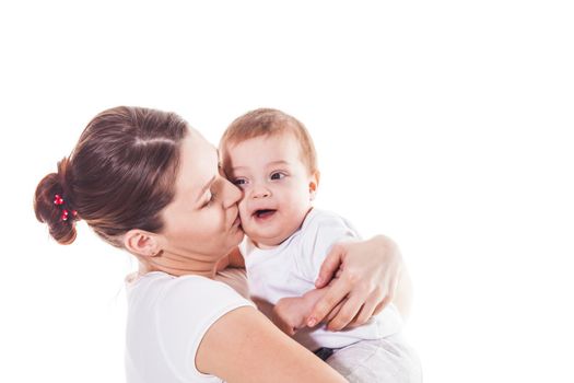 Portrait of a young mother holding her child on a white background, isolated