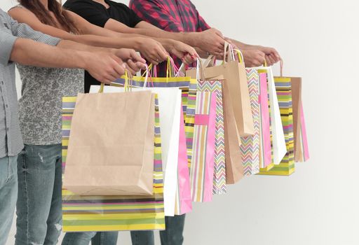 close up.buyers showing their colorful shopping bags.photo with copy space
