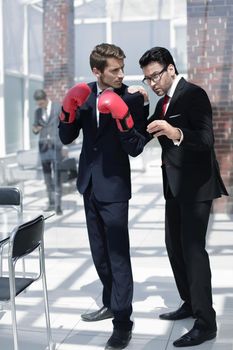 senior businessman advises a young colleague. the concept of business competition