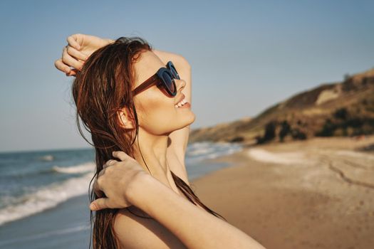 pretty woman in black swimsuit posing tanning tropics. High quality photo