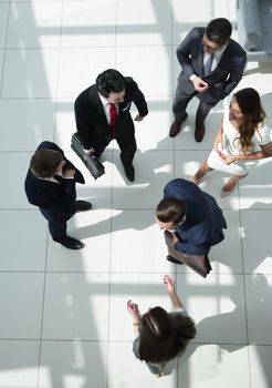 top view.a group of business people standing on a marble floor. business concept