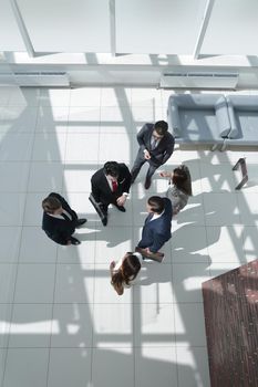 top view.a group of business people standing on a marble floor. business concept