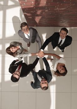 top view. the business team shows its unity . photo with text space
