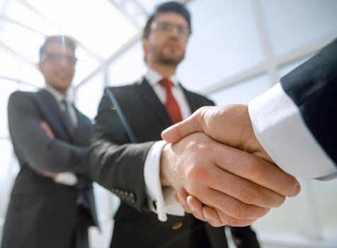 business background.business handshake.the concept of cooperation