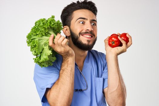 male doctor nutritionist with vegetables in hands healthy food. High quality photo